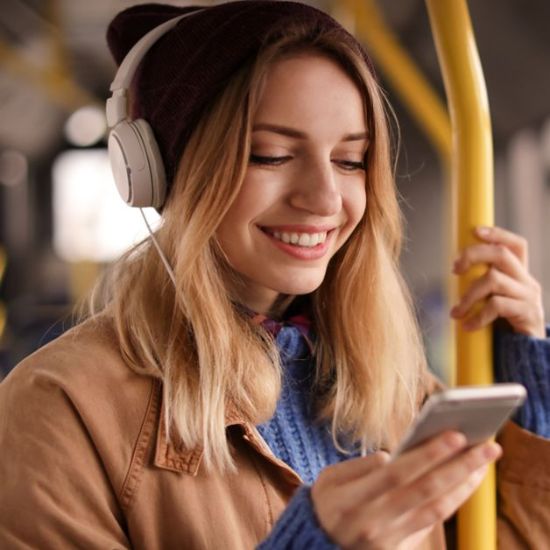 Young woman listening to Audiobooks
